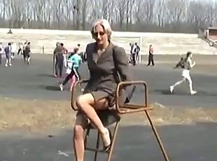 Hot blonde Russian MILF posing outdoors
